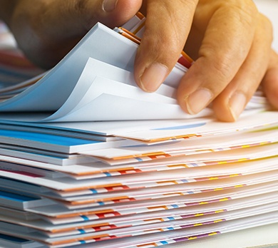 Stack of books being flicked through by a hand