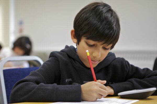 boy studying at a desk