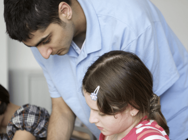 tutor helping child with work